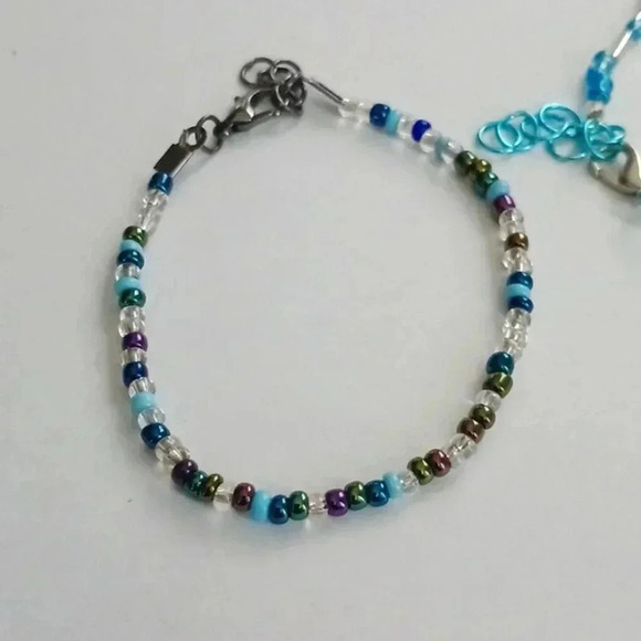 None Other - Bundle of 3. 1 bracelet.1 ankle bracelet  plus a silver n teal Skull necklace.